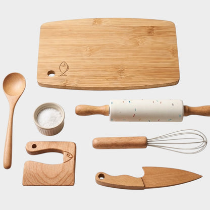 modplay My First Little Chef bundle featuring a wooden cutting board, rolling pin, whisk, spoon, and toy kitchen tools
